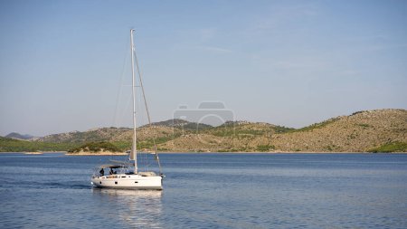 Coastal seaside scenic landscape of Dugi Otok island, luxury floating yacht in Adriatic Sea, Croatia