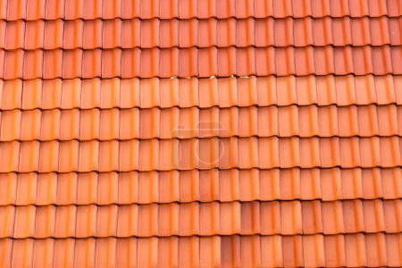 Tuiles de toit en argile rouge motif répété sans couture texture céramique fond