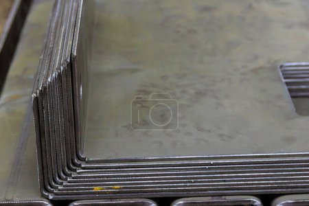 Photo for The finished product after bending on a sheet metal bending machine. Bending of various products at the metalworking plant. - Royalty Free Image