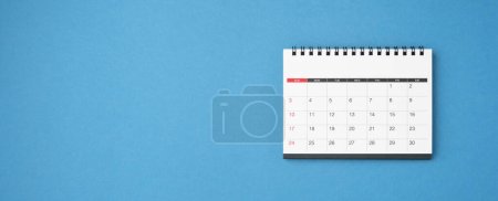 Photo for Calendar on blue background, top view - Royalty Free Image