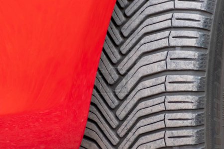 Photo for Close up of tyre of red car - Royalty Free Image