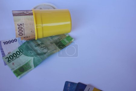 Photo for Indonesian rupiah banknotes. Concept of finance, investment, economy, business and success. Money in a yellow glass. Save your money. Money 5000 10000 20000 Rupiah - Royalty Free Image