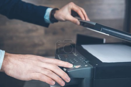 Photo for Young business man hand printer - Royalty Free Image