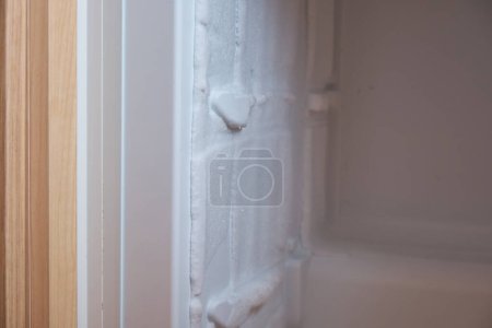 Photo for Freezer with ice on the walls in the built-in refrigerator. - Royalty Free Image