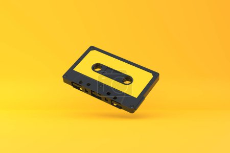 Téléchargez les photos : Cassette audio vintage sur fond jaune. Vue de face avec espace de copie. Illustration de rendu 3d - en image libre de droit
