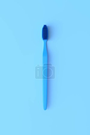 Téléchargez les photos : Brosse à dents en plastique close-up sur fond bleu avec espace de copie. Illustration de rendu 3d - en image libre de droit