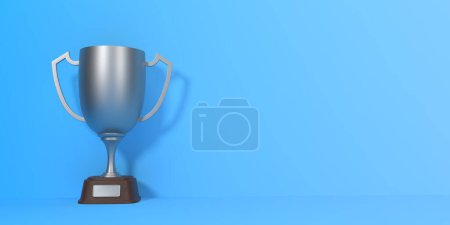 Téléchargez les photos : Coupe trophée sur fond bleu avec espace de copie. Prix du tournoi sportif, coupe gagnante d'argent et concept de victoire. Illustration de rendu 3d - en image libre de droit