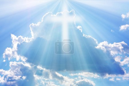 Easter background with a shining cross on blue sky with white clouds and lightbeam.