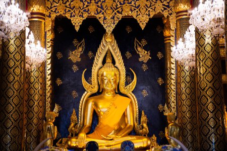 Photo for Interior of the vihara and Phra Phuttha Chinnarat buddha statue for thai people and foreign travelers travel visit respect praying at Wat Phra Si Rattana Mahathat or Yai Temple in Phitsanulok Thailand - Royalty Free Image