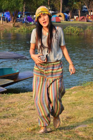 Foto de Travelers thai women people photographer journey travel visit rest relax and posing portrait for take photo in garden forest or jungle at Kaeng Krachan Dam and National Park in Phetchaburi, Thailand - Imagen libre de derechos