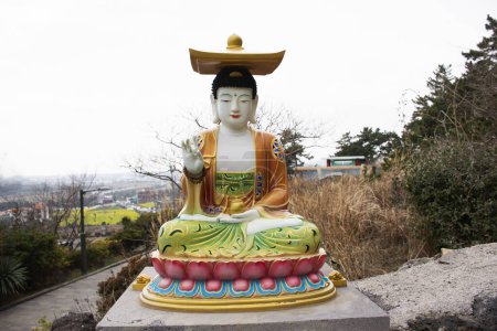 Photo for Colorful chinese god figure and deity angel buddha statue on stone stairs go to Sanbangsan mountain for korean people travelers travel visit respect praying in Sanbangsa Temple in Jeju do, South Korea - Royalty Free Image