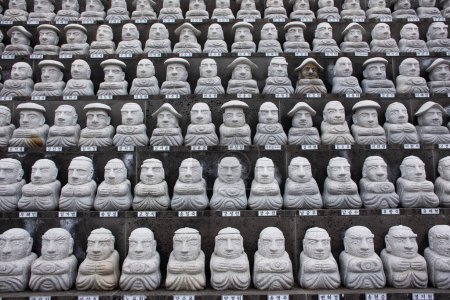 Photo for Ancient deity angel and small monks figure in Sanbangsa Temple for korean people travelers travel visit praying blessing wish mystery at Sanbangsa Temple on February 18, 2023 in Jeju do, South Korea - Royalty Free Image