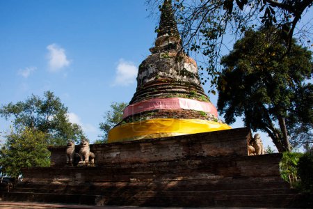 Ancient ruins stupa and antique old ruin pagoda chedi for thai people travelers visit respect praying blessing buddha wish mystical in Wat Mae Nang Pleum or Maenangpluem Temple in Ayutthaya, Thailand