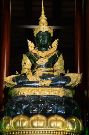 Ancient Emerald Buddha statue or Phra Kaeo Morakot for thai people travelers travel visit respect praying blessing wish holy mystery of Wat Phra Kaew or Pa Ya or Pa Yiea temple in Chiang Rai, Thailand