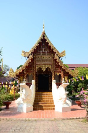 Ancient antique Ubosot Wihan Kaew for thai travelers people travel visit respect praying blessing buddha wish myth holy at Wat Phra Singh or Phra Sing temple at Chiangrai city in Chiang Rai, Thailand