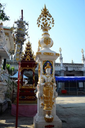 Art sculpture deity statue or carving angel figure lanna style of Wat Ming Mueang temple for thai people traveler visit respect praying blessing wish mystical at Chiangrai city in Chiang Rai, Thailand