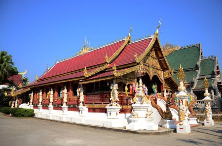 Ancient ordination hall or antique old ubosot for thai travelers people travel visit respect praying blessing buddha wish holy mystical at Wat Ming Muang temple at Chiangrai in Chiang Rai, Thailand