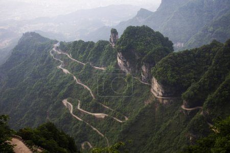 View landscape range mountain and road 99 curve turn for chinese people travelers travel visit Tianmen Shan cave Heaven Gate in Tianmenshan Mountain National Forest Park at Zhangjiajie in Hunan, China