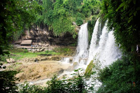 View landscape mountain forest jungle and waterfalls in antique Furong Zhen and Tujia ancient town city for chinese people foreign travelers travel visit rest relax at Yongshun County in Hunan, China