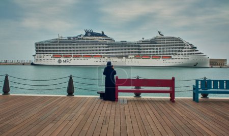 Téléchargez les photos : Old Doha port (Mina District) in Doha, Qatar afternoon shot showing  cruise ship ( MSC World Europa) . - en image libre de droit