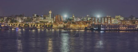 Photo for Luxor ,Egypt night shot from west bank showing Nile river with  Feluccas and Luxor Temple in East bank - Royalty Free Image