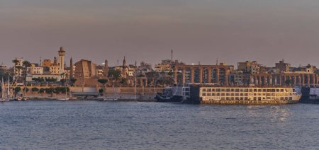 Photo for Luxor ,Egypt sunset shot from west bank showing Nile river with  Feluccas and Luxor Temple in East bank - Royalty Free Image