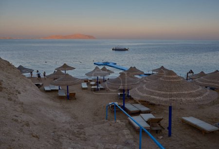Panoramic view of Sharks Bay  in Sharm El Sheikh , Egypt afternoon shot showing the red sea with tourists , Yachts and hotels in the background