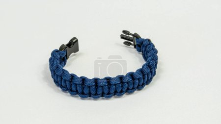 Photo for Braided paracord bracelet on a white background. Handmade, creative design. - Royalty Free Image