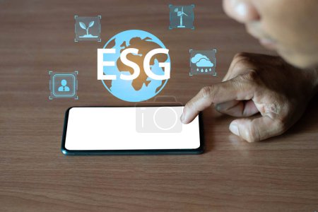 ESG icon concept in smart mobile phone for environment, society and governance in sustainable and ethical business on wireless network connection.