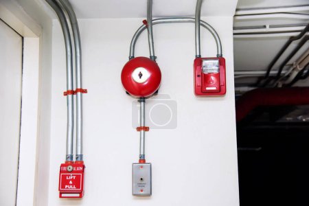 Fire alarm system in the parking lot with a red light bell