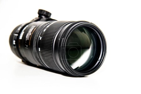 Camera lens isolated on a white background, focus on the lens.