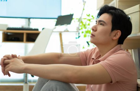 Photo of young Asian man at home