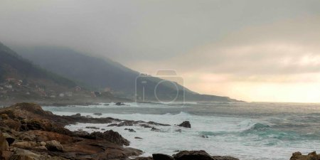 Photo for Cabo Silleiro, a lighthouse illuminating the sea on the hill - Royalty Free Image