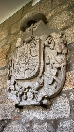 Coat of arms of the Spanish monarchy carved in stone