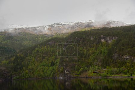 Snow peaked mountains in the fjords of Norway