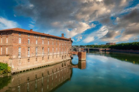 Toulouse is the capital of the Occitania region in southern France. It is divided by the Garonne River and is located near the border with Spain. It is known as La Ville Rose
