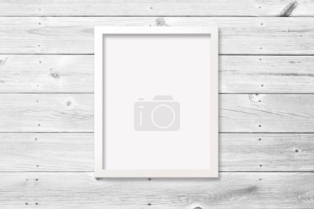 8x10 white vertical frame with empty poster against a modern wood plank background. Includes clipping path to make it easy to add your design to the frame.