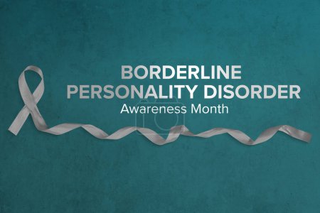 Photo for Photo of gray ribbon with curled end atop a concrete background for Borderline Personality Disorder Awareness Month. Modern sans serif font. - Royalty Free Image
