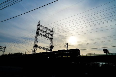 Photo for Seibu Tamagawa Line and sunset. Shooting Location: Fuchu City, Tokyo - Royalty Free Image