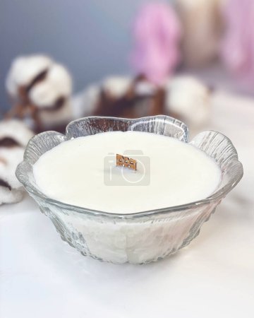 Photo for Handmade white candle in a vintage glass jar on a light background - Royalty Free Image