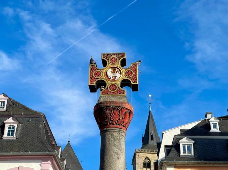 Photo for Oldest Market cross in Germany, with Latin dedication placed by Archbishop in 958, renovated 1724. Trier, Rhineland-Palatinate, Germany - Royalty Free Image
