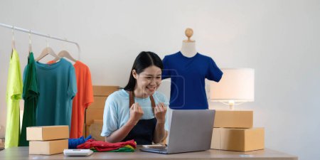 Photo for Young asian women happy after new order from customer. Surprise and shock face of asian woman success on making big sale of his online store. Online Selling. - Royalty Free Image