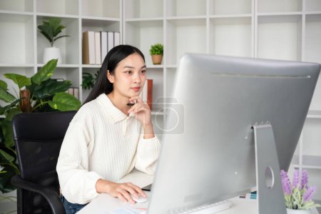 Photo for Beautiful business woman with determination Working on computer in home office. - Royalty Free Image