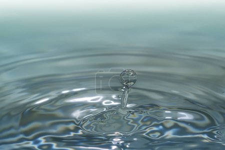 Photo for Clear aqua water droplet splashing in concentric circles, capturing refreshing purity. - Royalty Free Image