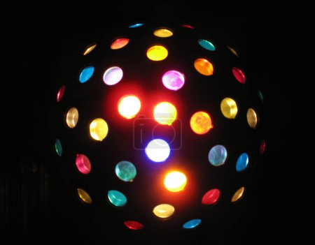 Colored disco ball for pop music and disco on a black background