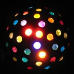 Colored disco ball for pop music and disco on a black background