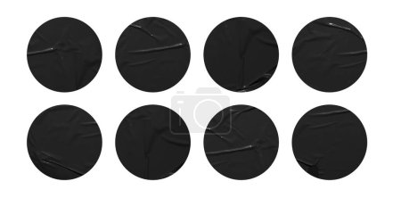 Foto de Conjunto de pegatinas redondas de papel negro se burlan de etiquetas en blanco, aisladas sobre fondo blanco con ruta de recorte - Imagen libre de derechos