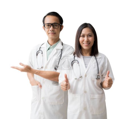 Photo for Medical Services. Asian doctor woman and man, Hand open palm up blank workspace with thump up, isolated on blue background - Royalty Free Image