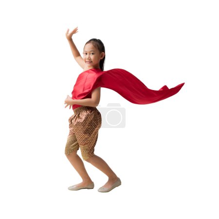 Photo for Full body Asian little girl in Thai national costumes with beautiful thai dance welcome of Thailand, isolated on pastel plain light blue background - Royalty Free Image