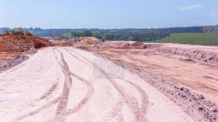 Photo for Construction New Roads Earthworks layout landscape moving sand compressing surfaces with heavy machines outdoors countryside economy expansion projects. - Royalty Free Image